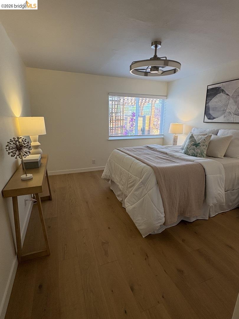 1728 Seventh Street, Unit A Berkeley, CA 94710 - Photo 2 of 5 a bedroom with a bed and window