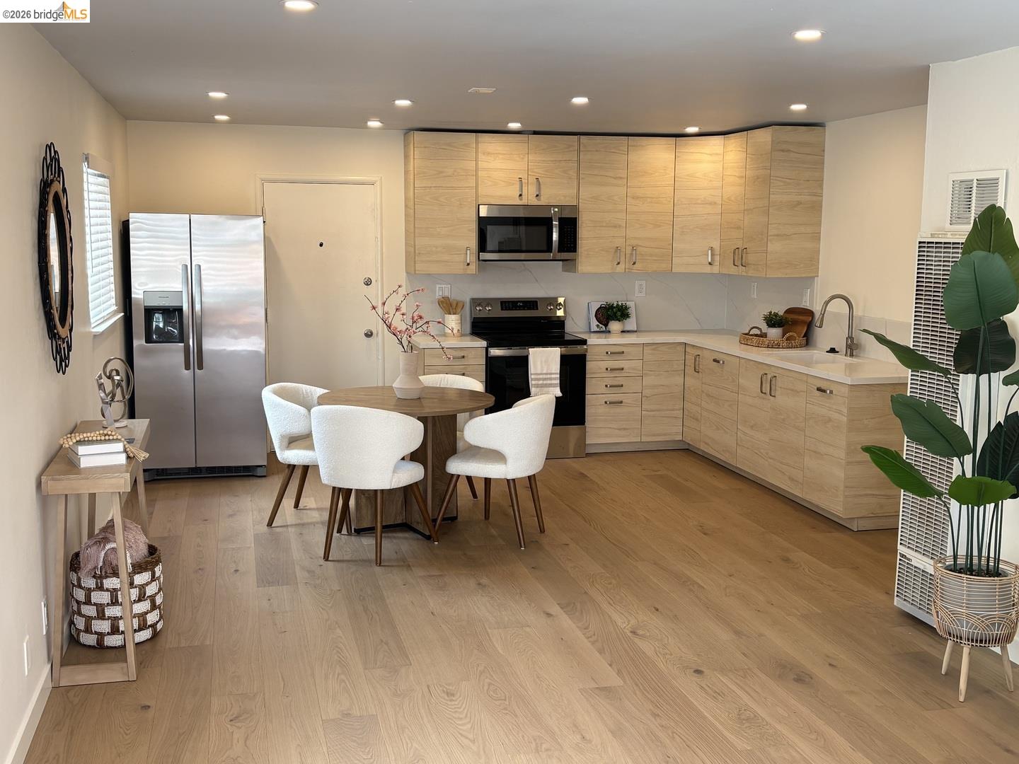 1728 Seventh Street, Unit A Berkeley, CA 94710 - Photo 4 of 5 a large kitchen with a table chairs refrigerator and a sink