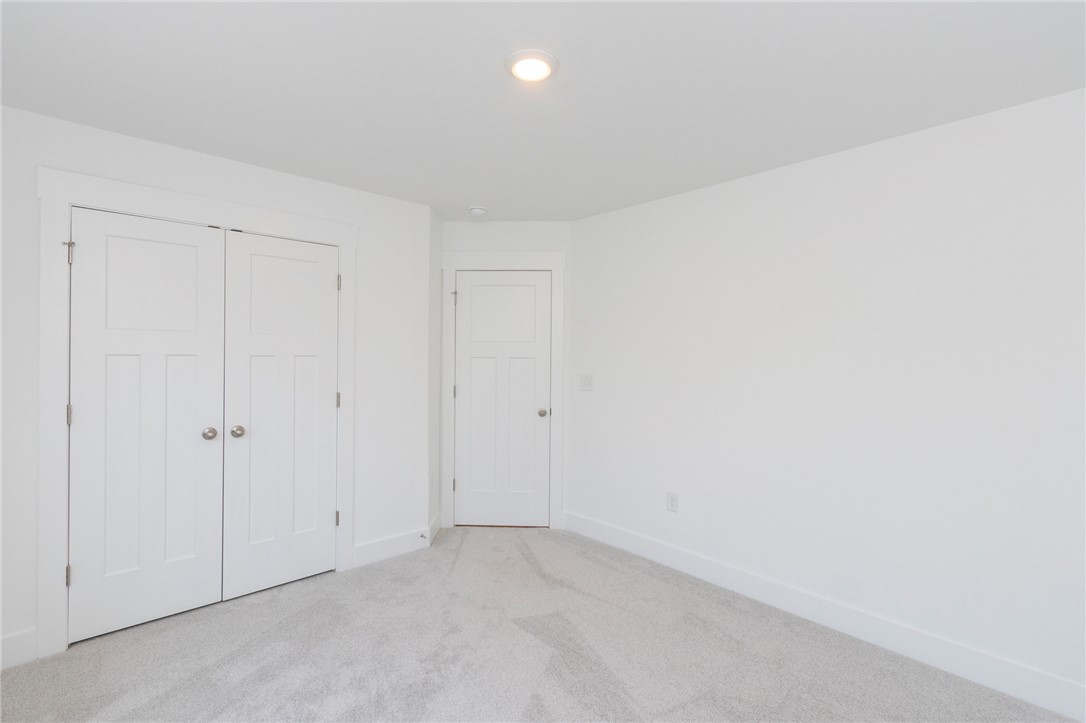 607 WH Kay Lane Anderson, SC 29621 - Photo 25 of 48 A well-lit bedroom with ample closet space and plush carpeting.