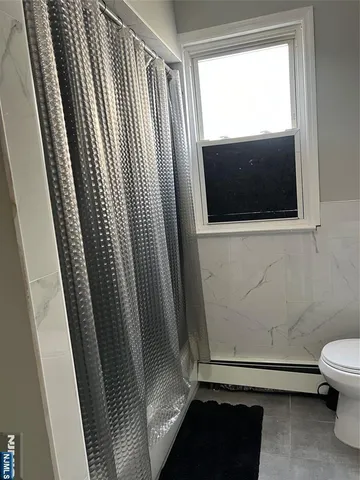 a bedroom with a bed and a table in it