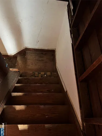 a sitting area with furniture and wooden floor