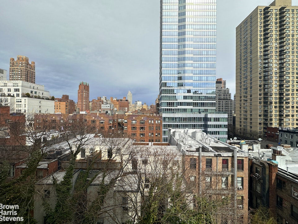 235 East 73rd Street, Unit 8D Manhattan, NY 10021 - Photo 6 of 9 a city view with tall buildings