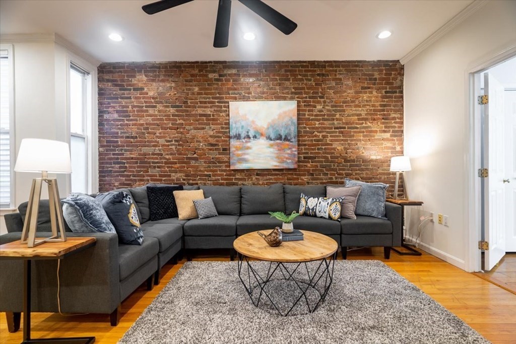 245 West Fifth Street, Unit 2 Boston, MA 02127 - Photo 1 of 34 a living room with furniture and a rug
