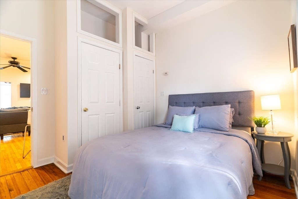 245 West Fifth Street, Unit 2 Boston, MA 02127 - Photo 13 of 34 a bedroom with a bed and lamps