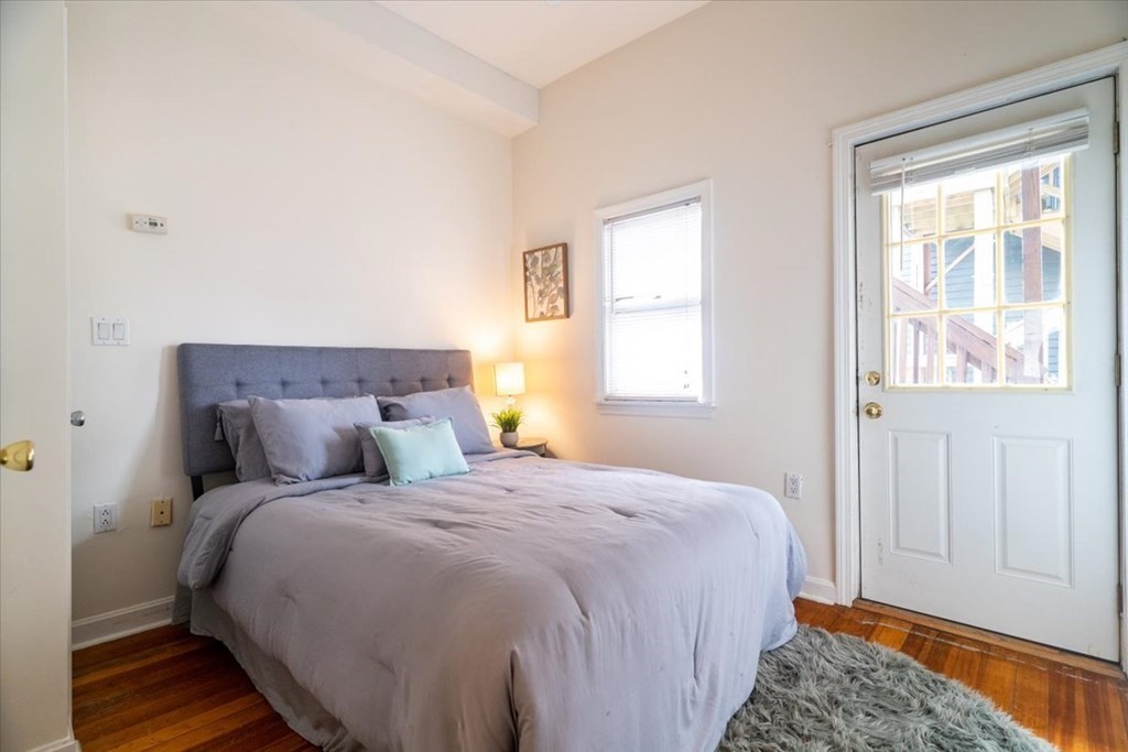 245 West Fifth Street, Unit 2 Boston, MA 02127 - Photo 14 of 34 a bedroom with bed and window