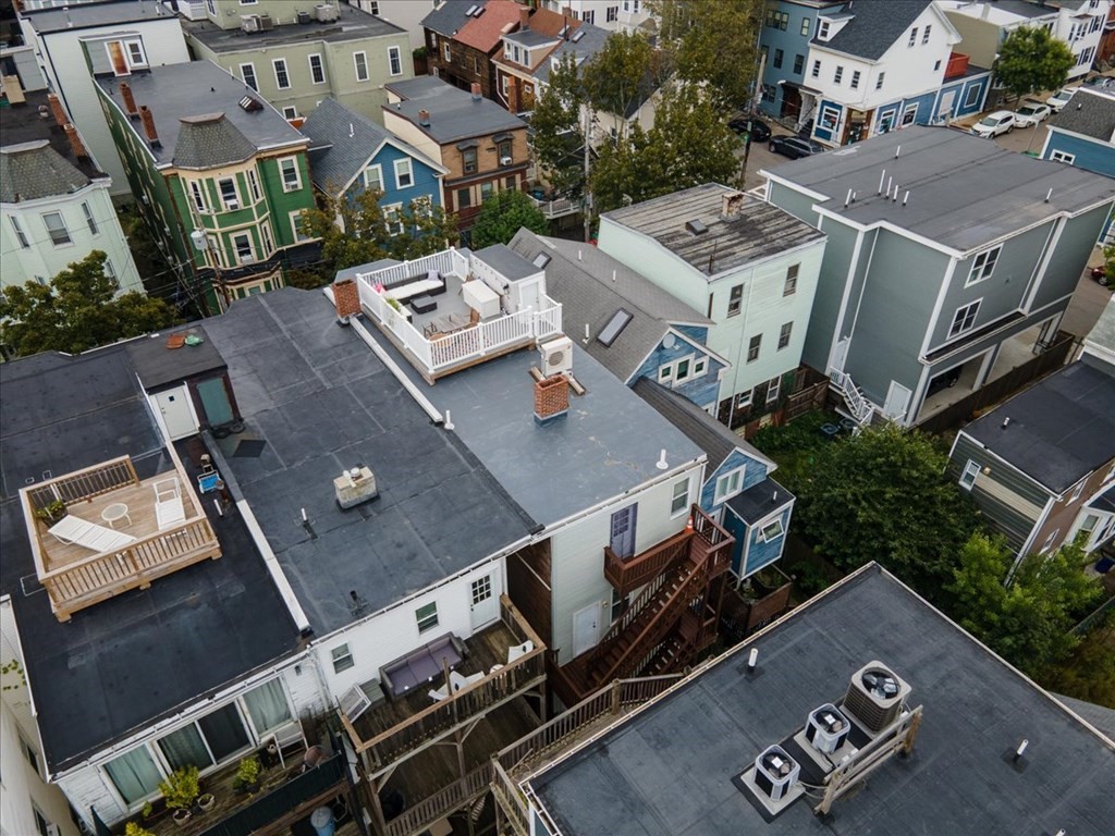 245 West Fifth Street, Unit 2 Boston, MA 02127 - Photo 26 of 34 an aerial view of residential houses with outdoor space