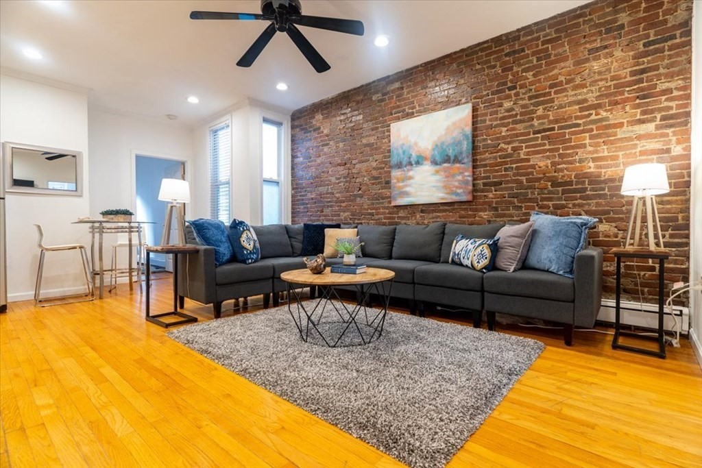 245 West Fifth Street, Unit 2 Boston, MA 02127 - Photo 4 of 34 a living room with furniture and a rug