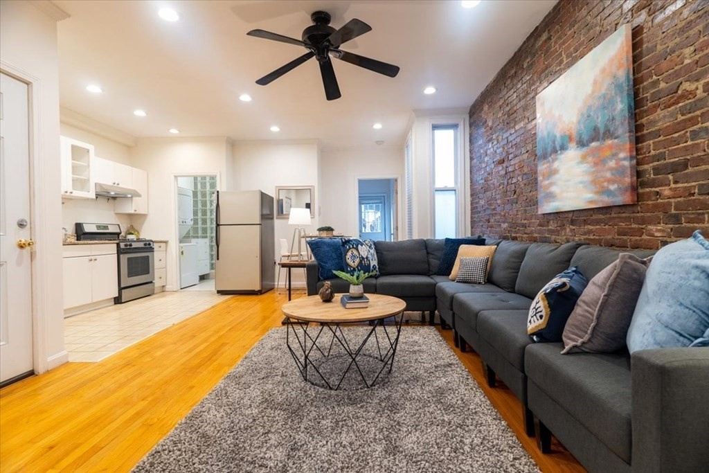 245 West Fifth Street, Unit 2 Boston, MA 02127 - Photo 5 of 34 a living room with stainless steel appliances kitchen island granite countertop furniture and a large window