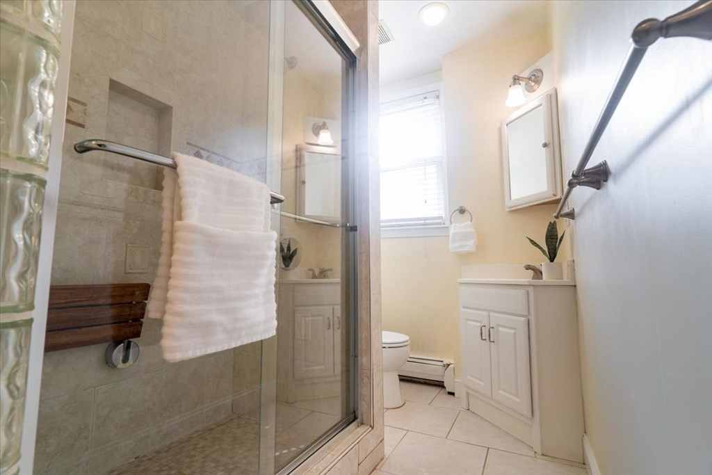 245 West Fifth Street, Unit 2 Boston, MA 02127 - Photo 9 of 34 a bathroom with a shower and a toilet