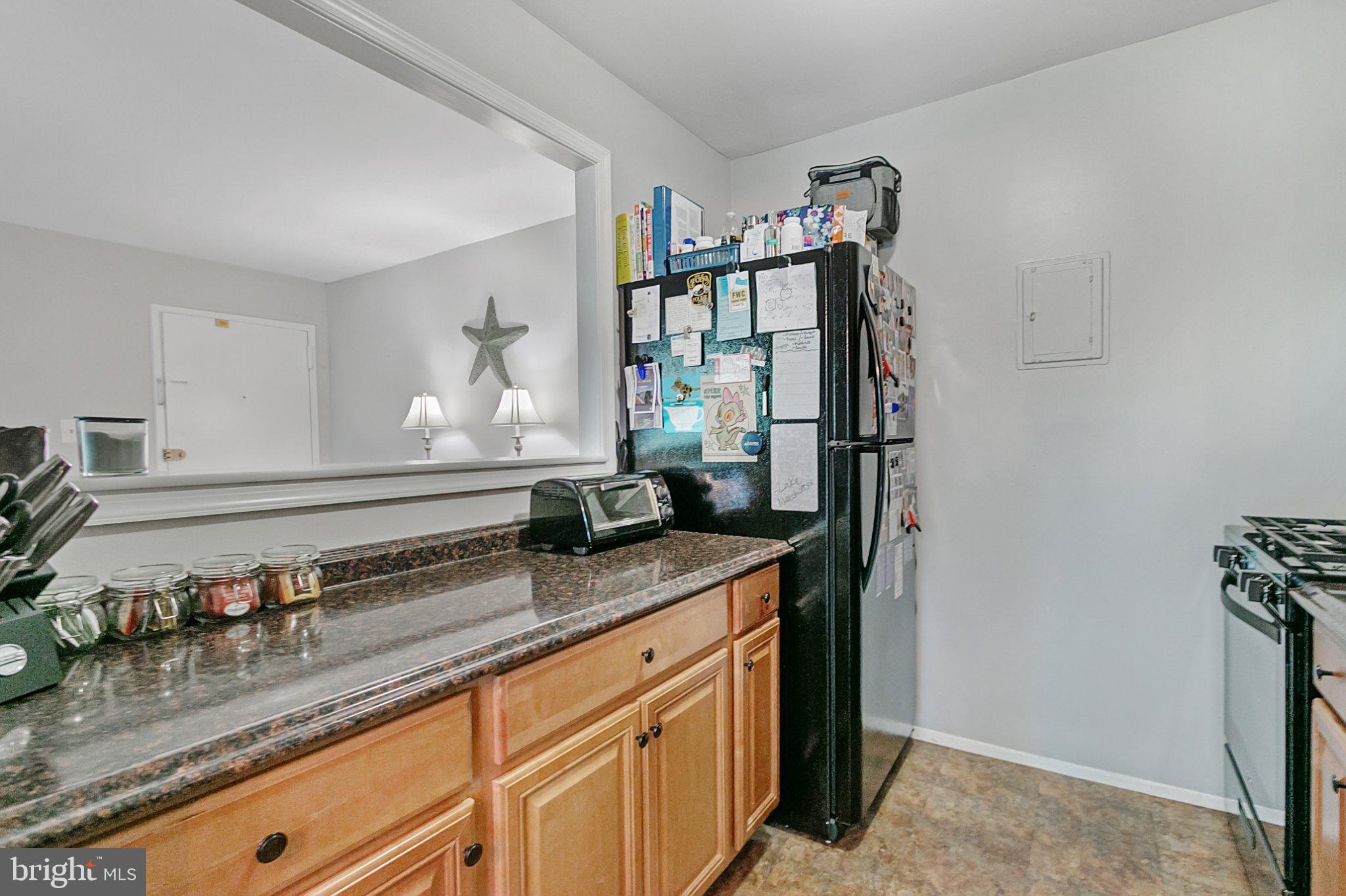 3750 Bel Pre Road, Unit 11 Silver Spring, MD 20906 - Photo 13 of 27 a kitchen with sink and cabinets