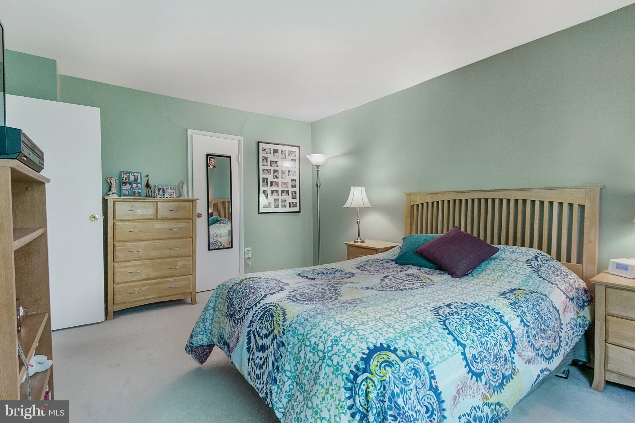 3750 Bel Pre Road, Unit 11 Silver Spring, MD 20906 - Photo 16 of 27 a bedroom with a bed and dresser