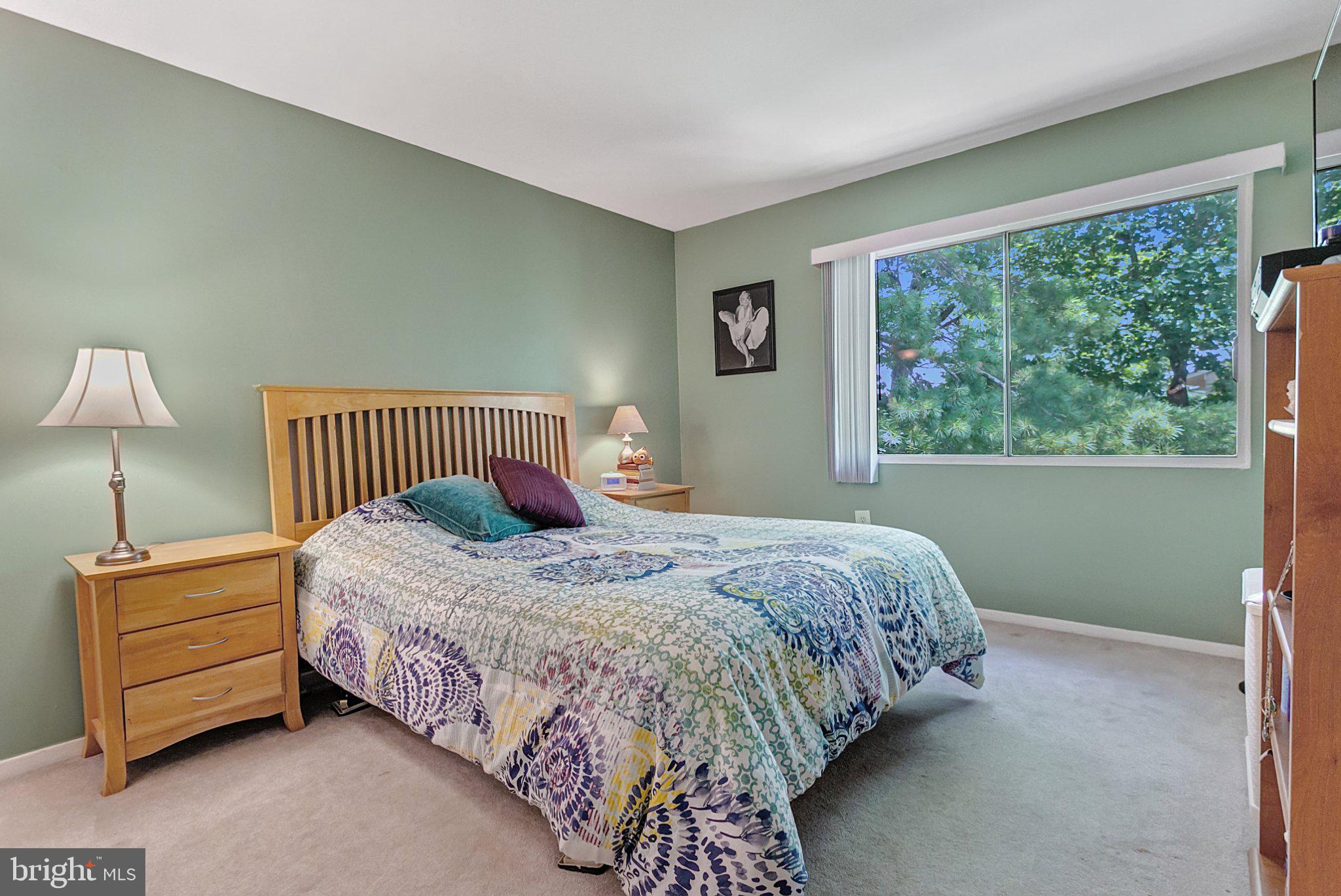 3750 Bel Pre Road, Unit 11 Silver Spring, MD 20906 - Photo 19 of 27 a bedroom with a bed and a window