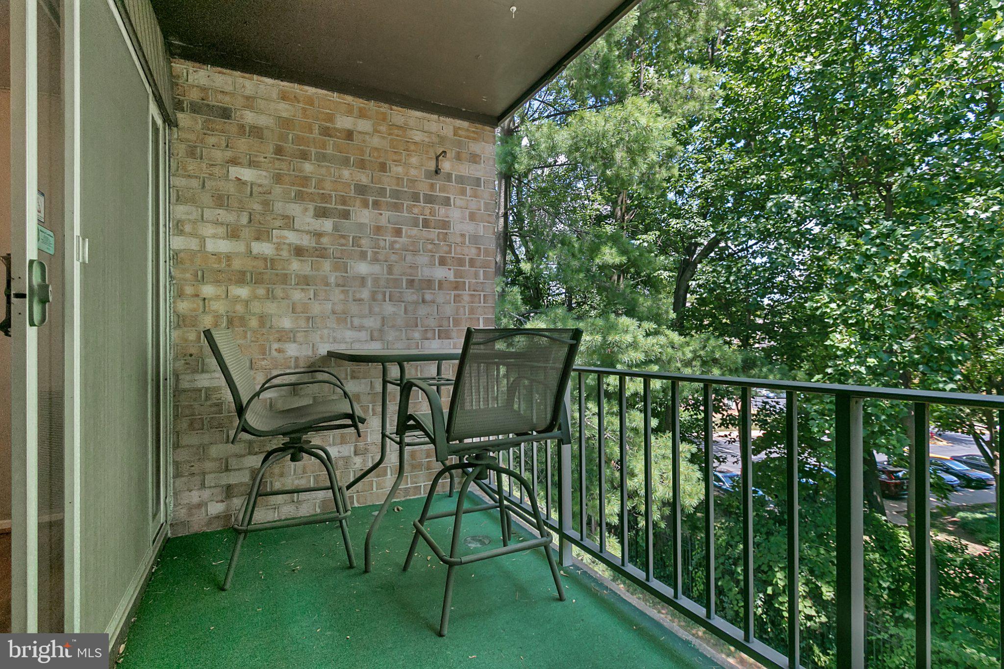 3750 Bel Pre Road, Unit 11 Silver Spring, MD 20906 - Photo 23 of 27 a view of a chair and table in the balcony