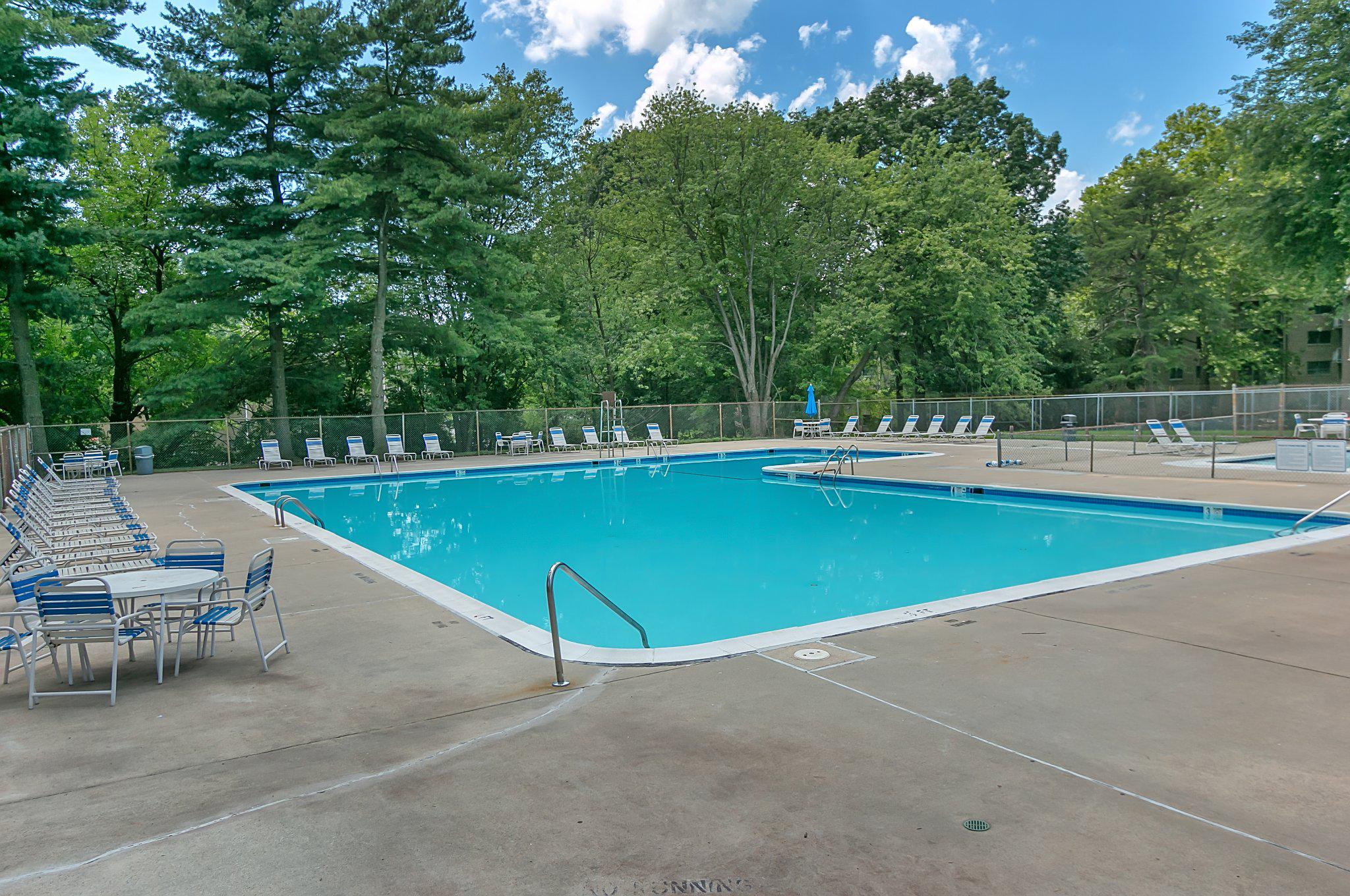 3750 Bel Pre Road, Unit 11 Silver Spring, MD 20906 - Photo 27 of 27 a view of a swimming pool with a lounge chair