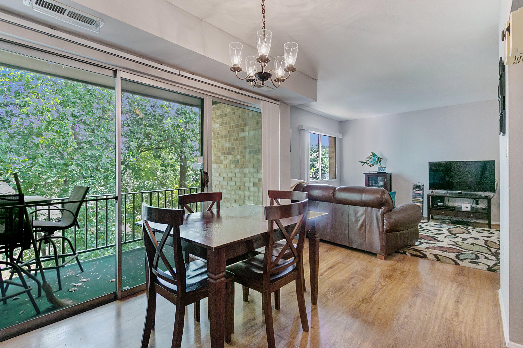 3750 Bel Pre Road, Unit 11 Silver Spring, MD 20906 - Photo 8 of 27 a view of a dining room with furniture window and wooden floor