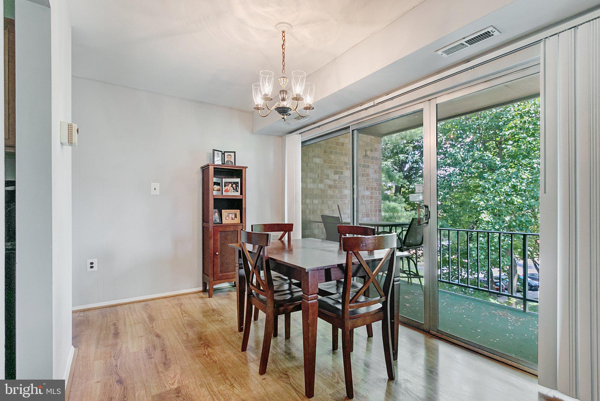 3750 Bel Pre Road, Unit 11 Silver Spring, MD 20906 - Photo 10 of 27 a view of a dining room with furniture window and outside view