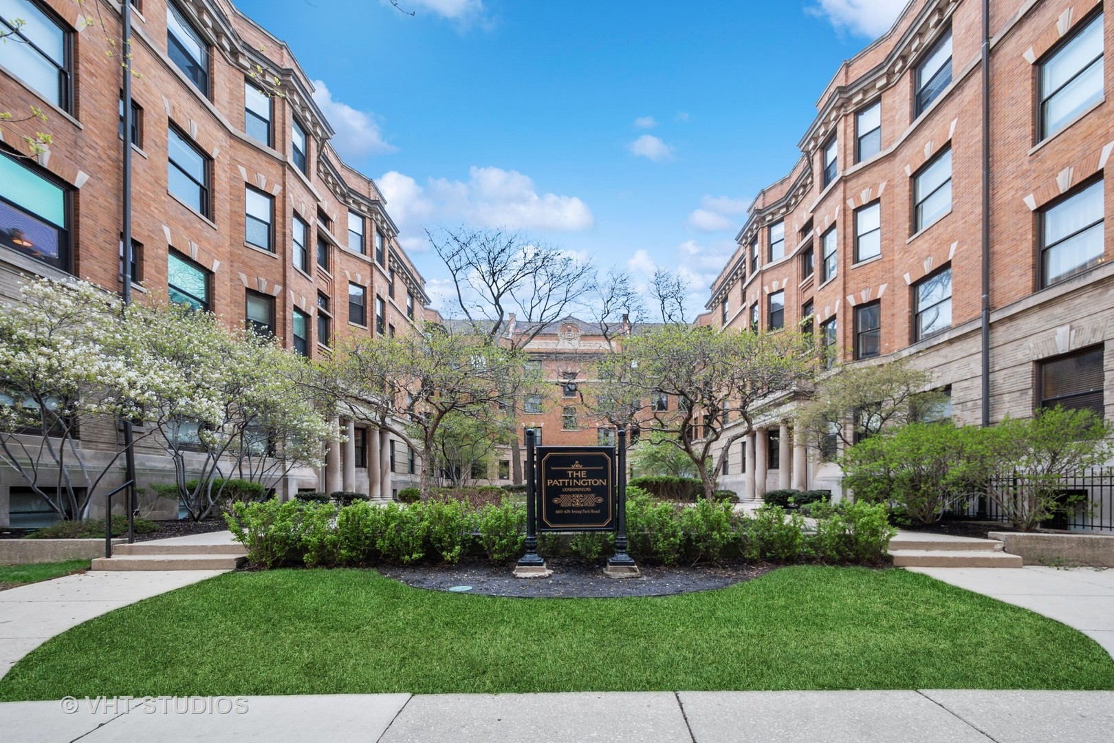 672 West Irving Park Road, Unit G1 Chicago, IL 60613 - Photo 1 of 19 a view of a building with a yard