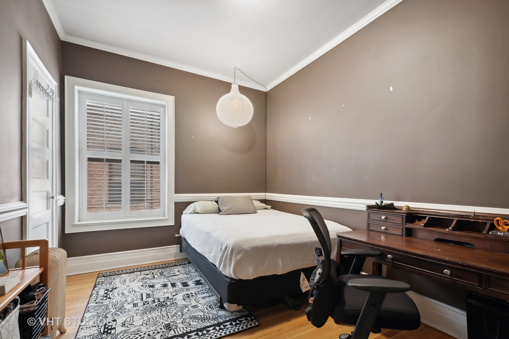 672 West Irving Park Road, Unit G1 Chicago, IL 60613 - Photo 11 of 19 a bedroom with a bed a dresser and chair
