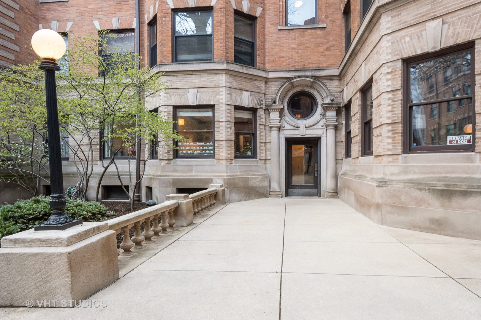 672 West Irving Park Road, Unit G1 Chicago, IL 60613 - Photo 2 of 19 a large building with swimming pool in front of it