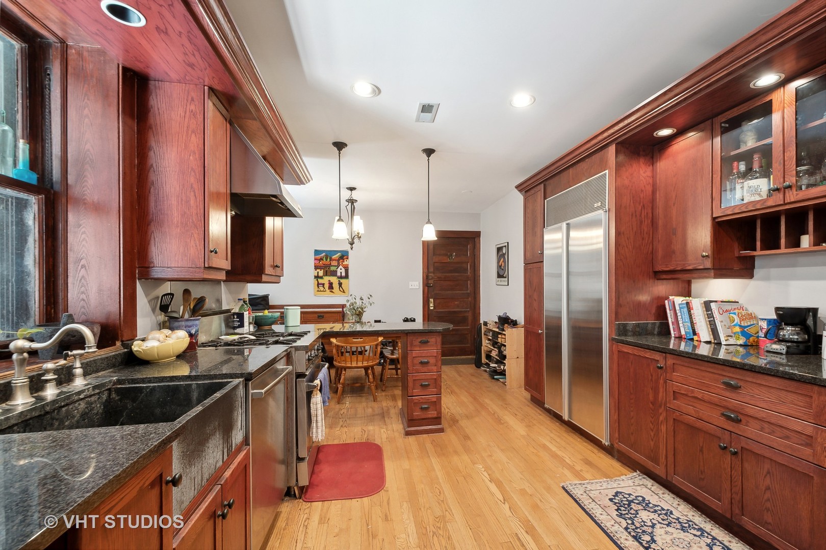 672 West Irving Park Road, Unit G1 Chicago, IL 60613 - Photo 7 of 19 a kitchen with lots of counter top space a sink and stainless steel appliances