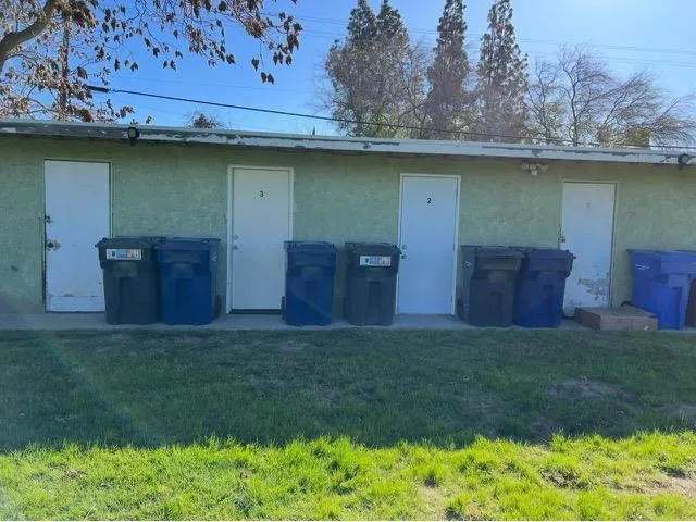 a view of a wooden fence in front of a house