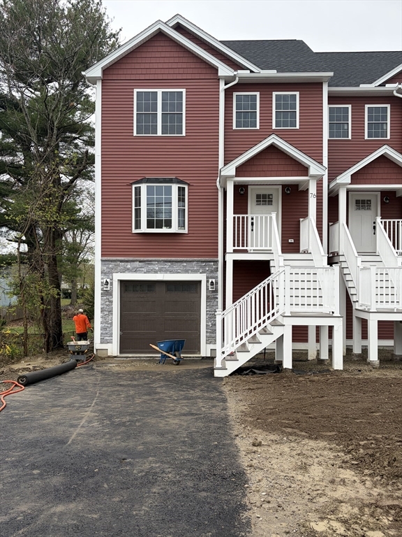 76 Valmor Street Worcester, MA 01604 - Photo 2 of 20 a front view of a house with a yard