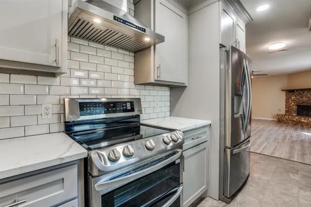 a kitchen with a stove and a microwave