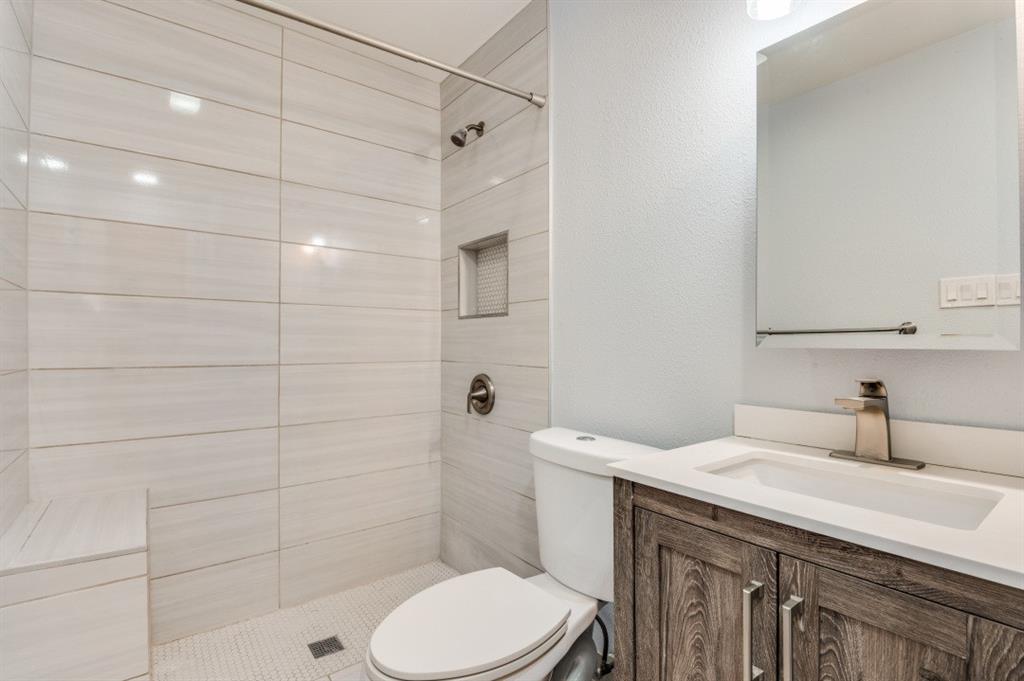 628 Thompson Street Everman, TX 76140 - Photo 13 of 24 a bathroom with a sink toilet and shower