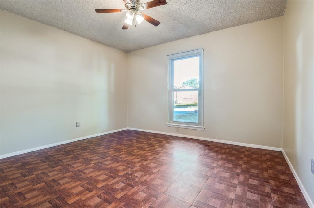 628 Thompson Street Everman, TX 76140 - Photo 18 of 24 a view of an empty room with a window and closet area