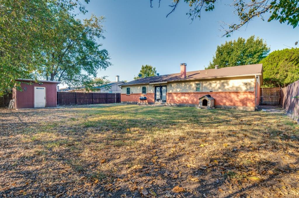 628 Thompson Street Everman, TX 76140 - Photo 22 of 24 a view of a house with backyard and a tree