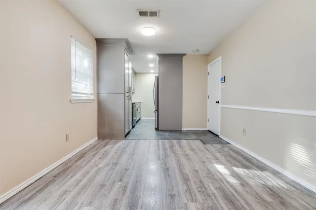 a view of wooden floor in an empty room