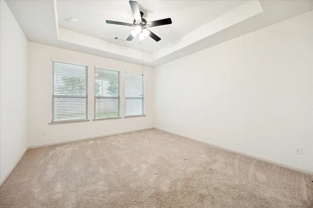 a bed room with a bed and a dresser