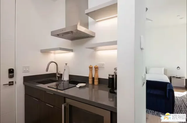 a kitchen with a sink and cabinets
