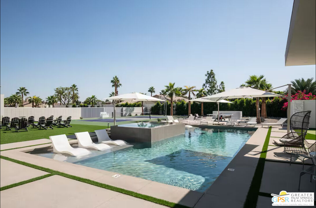 80883 Elemento Lane Indio, CA 92201 - Photo 31 of 47 a view of swimming pool with outdoor seating