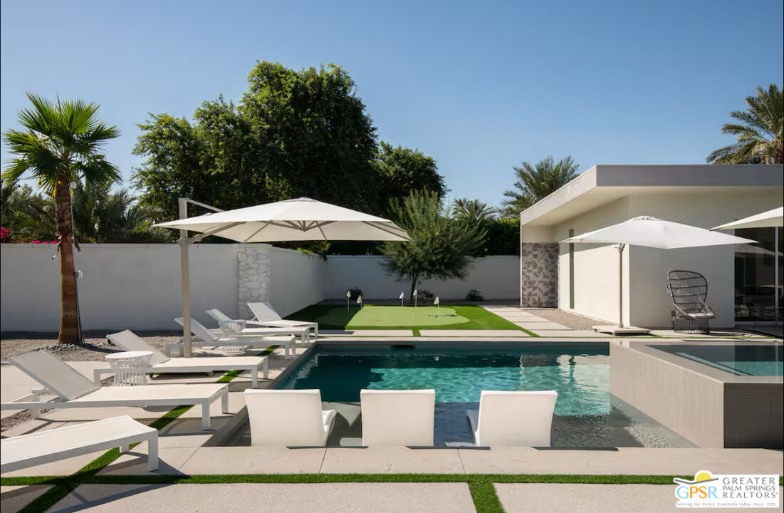 80883 Elemento Lane Indio, CA 92201 - Photo 32 of 47 a front view of house with yard outdoor seating and barbeque oven