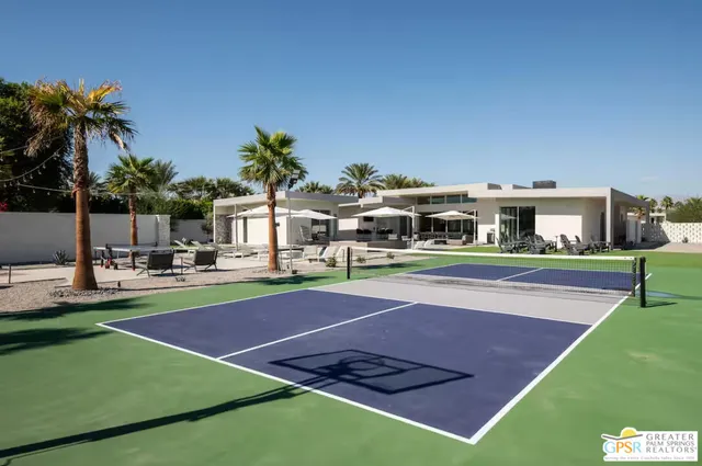 a view of an outdoor space and basketball court