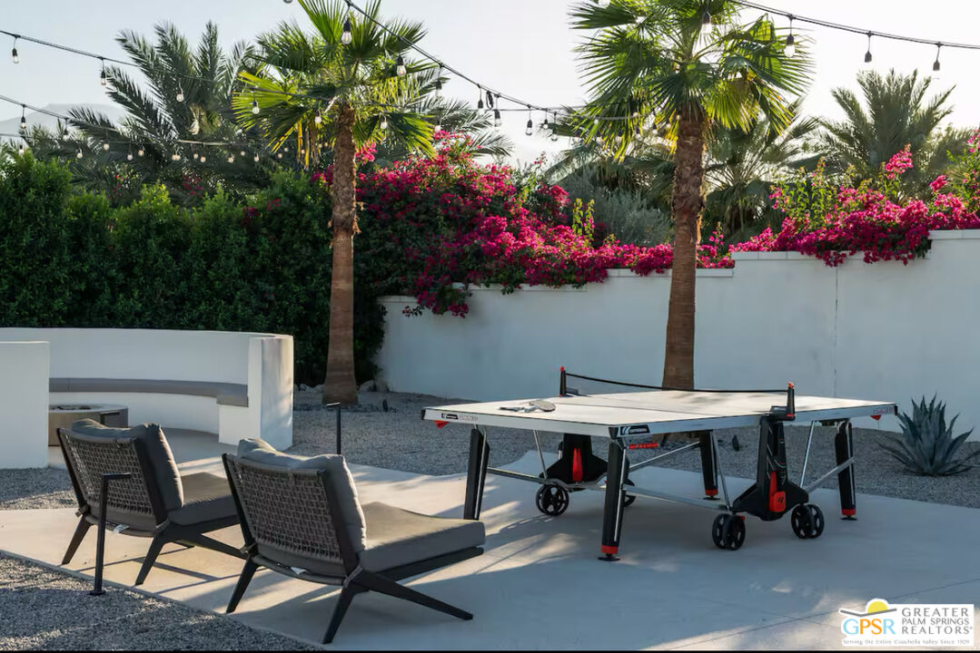 80883 Elemento Lane Indio, CA 92201 - Photo 36 of 47 a view of a outdoor space with a table and chairs