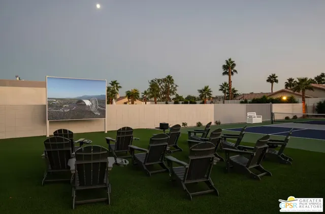 a view of a dining room with furniture and window