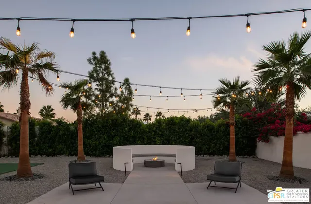 a view of swimming pool with outdoor seating and a patio