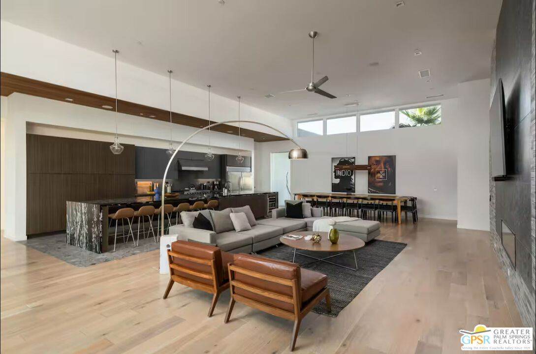 80883 Elemento Lane Indio, CA 92201 - Photo 9 of 47 a living room with furniture and a wooden floor