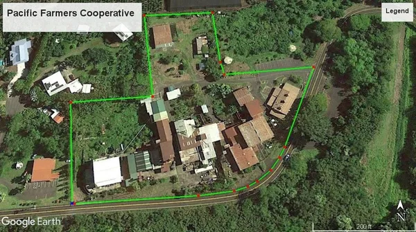 an aerial view of a house with a yard and garden