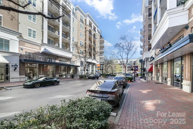 a view of a street with cars on a road