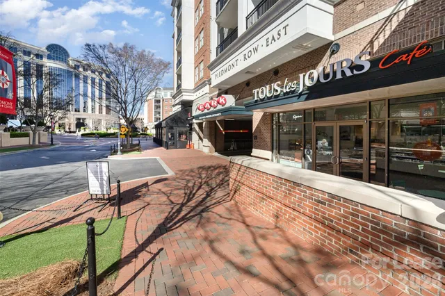 a view of a building with sitting area