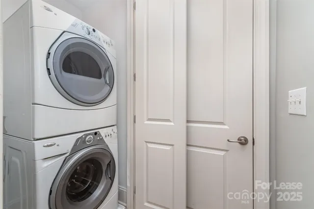a view of a hallway with washer and dryer