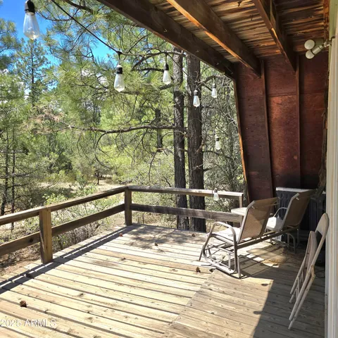 a view of a couches with wooden floor