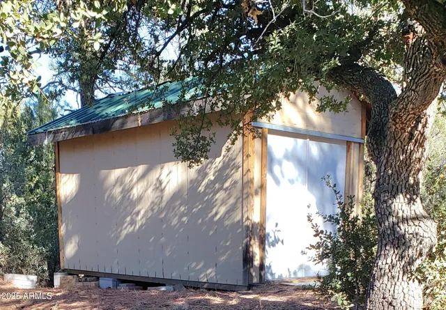 a view of a tree with yard
