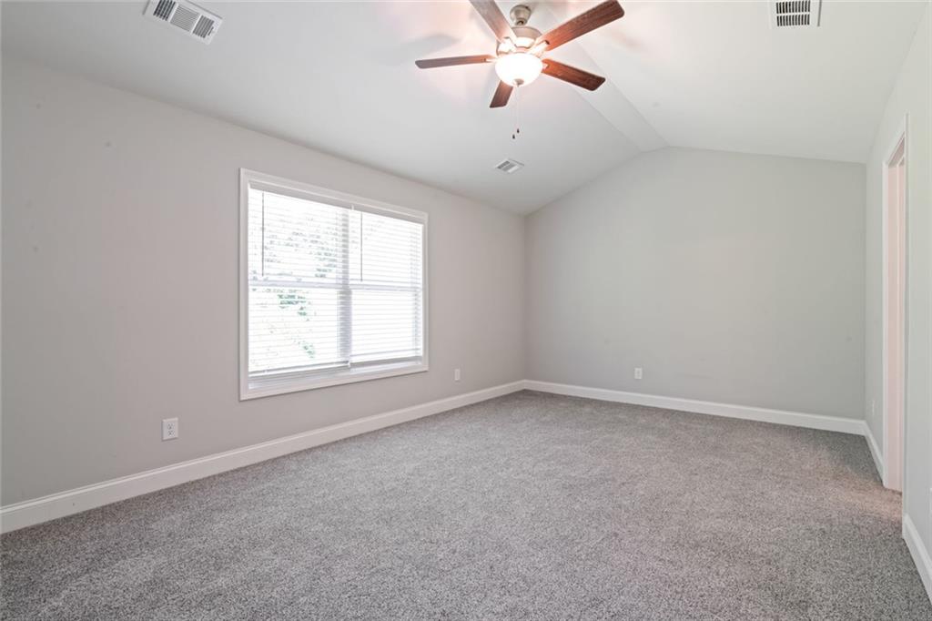 2707 Hickory Lane Dawsonville, GA 30534 - Photo 20 of 31 an empty room with a window and a fan