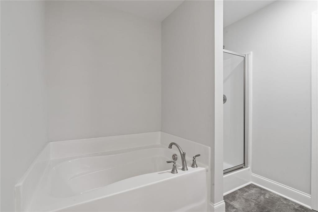 2707 Hickory Lane Dawsonville, GA 30534 - Photo 22 of 31 a white bath tub sitting next to a window