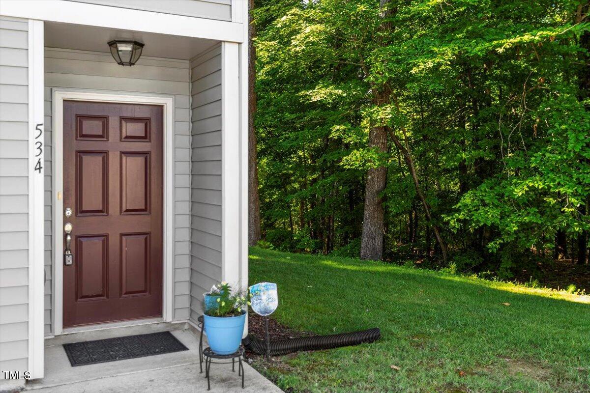 534 Hobkirks Place Durham, NC 27704 - Photo 34 of 34 a view of a chair and table in front of house