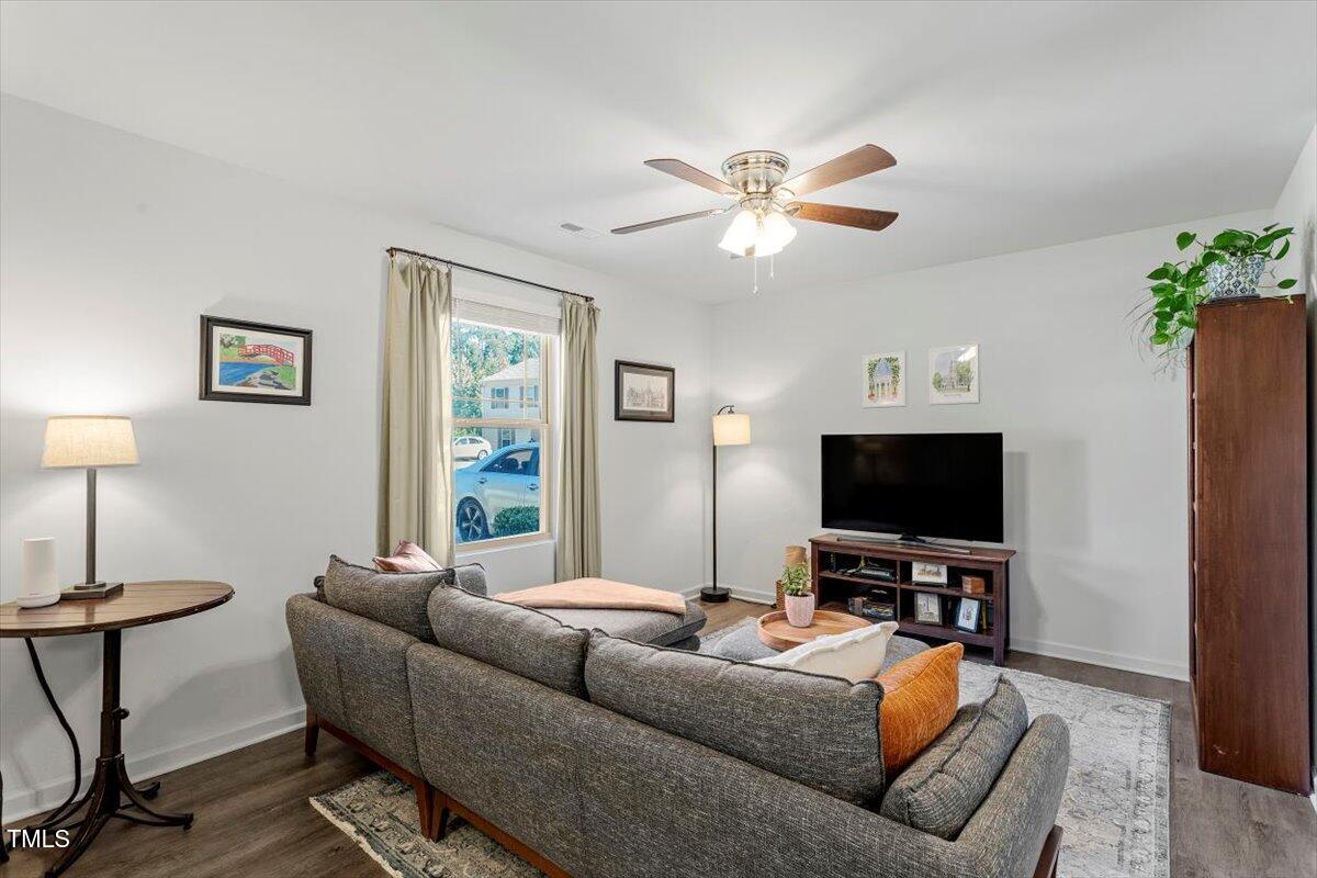 534 Hobkirks Place Durham, NC 27704 - Photo 5 of 34 a living room with furniture and a flat screen tv